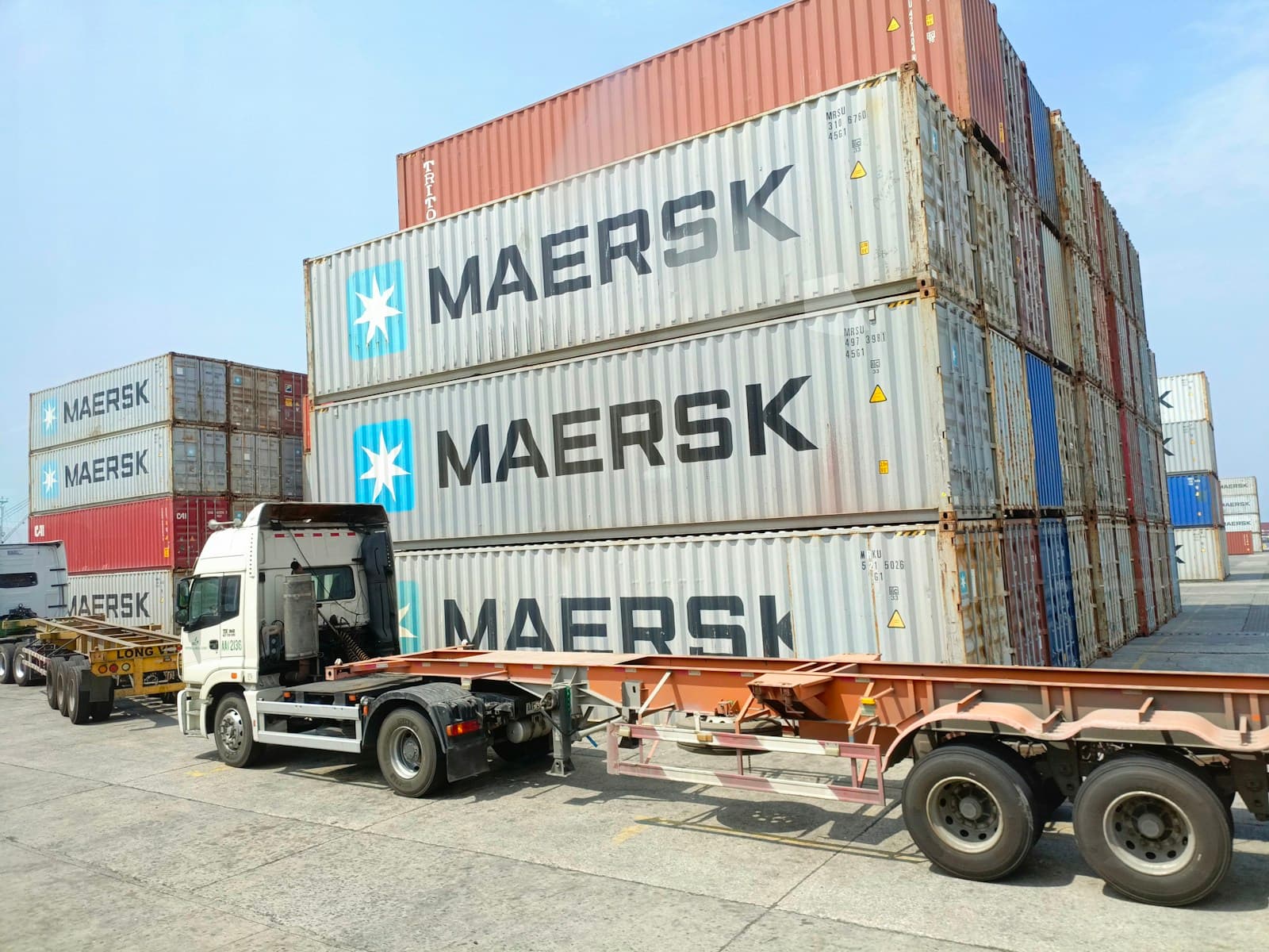Container truck loaded with shipping containers